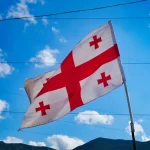 Key phrases in Kartuli, the uniqueness of the Mkhedruli script, and where English/Russian are most common