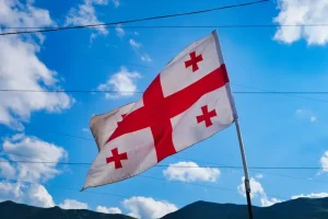 Key phrases in Kartuli, the uniqueness of the Mkhedruli script, and where English/Russian are most common